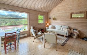a living room with a couch and a table at 1 Bedroom Cozy Home In Førde I Hordaland in Erve