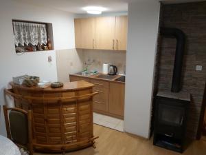 a kitchen with a table and a stove at Green Paradise in Visoko +2 photos