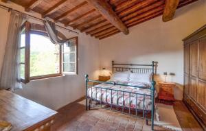 a bedroom with a bed in a room with a window at Pet Friendly Apartment In Bibbiena With Wifi in Serravalle
