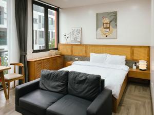 Ένα ή περισσότερα κρεβάτια σε δωμάτιο στο The 1Home - 69 Tố Hữu