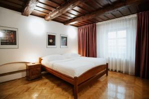 a bedroom with a large bed and a window at OREA Hotel Arigone Olomouc in Olomouc