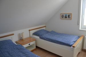 Ένα ή περισσότερα κρεβάτια σε δωμάτιο στο Perlmuschel