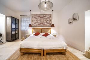 a bedroom with a large bed in a room at City of David - Boutique Stay by the Western Wall in Jerusalem