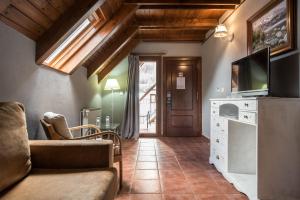 TV a/nebo společenská místnost v ubytování Hotel SNÖ Beret