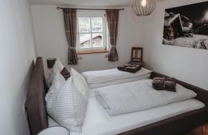 Postel nebo postele na pokoji v ubytování Hohlbichlgut + 9 fotografií