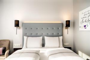 Ένα ή περισσότερα κρεβάτια σε δωμάτιο στο Premier Inn München City Ost