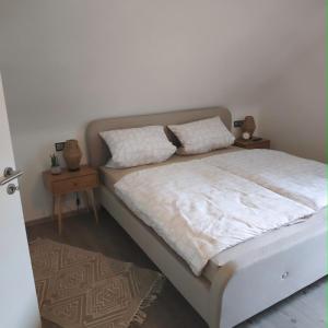 Postel nebo postele na pokoji v ubytování Haus Kerkyra