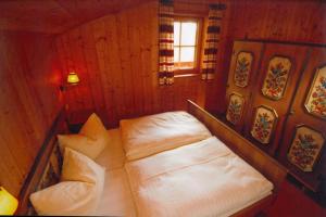 Postel nebo postele na pokoji v ubytování Vordergottschallalm