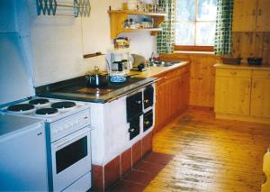 Kuchyň nebo kuchyňský kout v ubytování Maierlehenalm