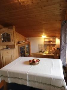 a bowl of apples on a table in a kitchen at Chalet Luxeck in Steinberg am Rofan +1 photo