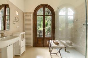 a bathroom with a tub and a sink and a shower at Villa Paolo Lemon Tree in Portovenere +94 photos