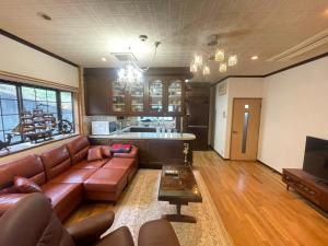 Et opholdsområde på CORNELL private guesthouse BBQ & Garden