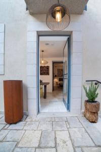 a hallway of a house with a glass door at City of David - Boutique Stay by the Western Wall in Jerusalem +25 photos