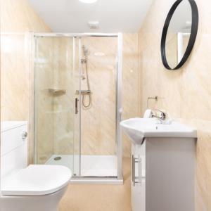 a bathroom with a shower and a toilet and a sink at Stylish 2 Bedroom Apartment - Netflix - Off Street Parking 1DS in Amblecote