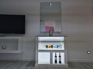 a display case with bottles of wine in a room at Secrets Torrevieja in Torrevieja