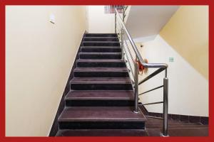 a flight of stairs in a building at Hotel PD Residency Near Bypass Road in Digha