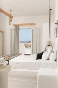 Postel nebo postele na pokoji v ubytování Irida Vacation Suites