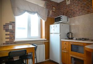 Η κουζίνα ή μικρή κουζίνα στο Doba in ua Starokazatskay Apartments