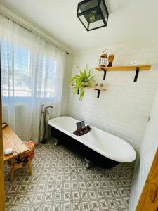 a bath tub in a bathroom with a tile floor at Central Santiago Haven in Santiago +45 photos
