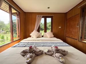 Ένα ή περισσότερα κρεβάτια σε δωμάτιο στο The Good View Koh Yao Noi