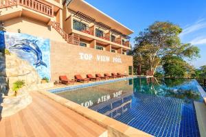 a swimming pool in front of a building at View Garden Resort in Phi Phi Islands