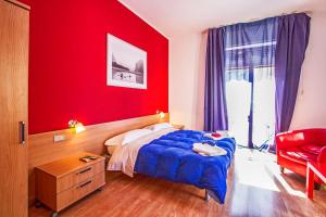 Ένα ή περισσότερα κρεβάτια σε δωμάτιο στο Central Plaza Lecce