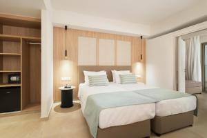 Postel nebo postele na pokoji v ubytování Maris Grand Waterpark Resort