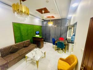 a living room with a couch and a table at Travel Inn clifton in Karachi