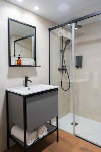 a bathroom with a sink and a shower at BUBU Apartments By Exclusive Homes in Málaga