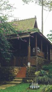 a stone house with a staircase leading to it at KAIA Camp by Kalimaya in Cicadas