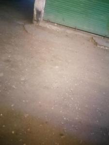 a room with a dirt floor and a green wall at Pyramids in Ṭalkha