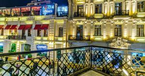 a view of a building at night at VIP Apartment in Nizami street Downtown in Baku