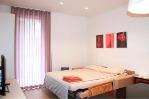 a bedroom with a bed and a window at WELCOME residenza esclusiva via Liverani Imola in Imola +66 photos