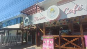 a dunkin donuts building with a sign on it at Pousada Ilha do Itacolomi Com Piscina Proximo do Beto Carrero in Penha +35 photos