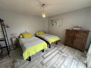 Postel nebo postele na pokoji v ubytování Chez petite zelinde