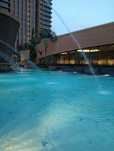 a large pool of water in front of a building at Crown Suits At Times Square in Kuala Lumpur