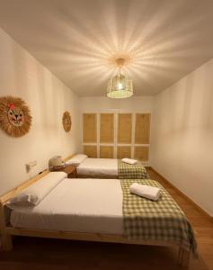 Postel nebo postele na pokoji v ubytování Arafita, cálido y familiar - Arafita Apartamentos