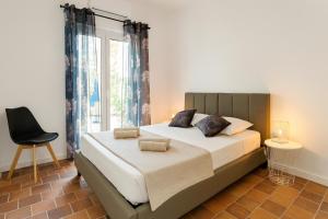 Ένα ή περισσότερα κρεβάτια σε δωμάτιο στο Villa Sole e Mare