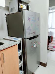 a refrigerator with writing on it in a kitchen at Manhattan Heights TowerD-Unit5 Viv's room Studio type in Manila