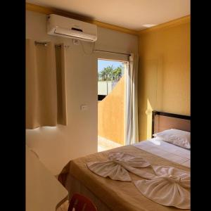 Postel nebo postele na pokoji v ubytování Flip Palace Hotel