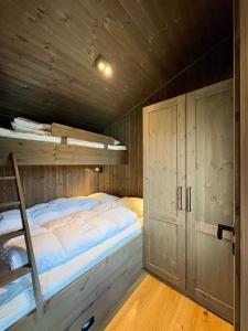 Ένα ή περισσότερα κρεβάτια σε δωμάτιο στο Hemsedal ski in ski out, modern comfort by the slopes