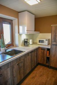 Kuchyň nebo kuchyňský kout v ubytování Ferienwohnung Osterberg