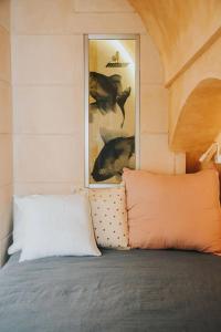 Ένα ή περισσότερα κρεβάτια σε δωμάτιο στο Grotta Angolo Laggetto