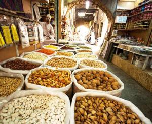 a market with many different types of nuts in baskets at Bait Al Aqr in Nizwa