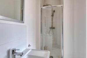 a bathroom with a shower and a sink at Green 3 - Roubaix Gare in Roubaix
