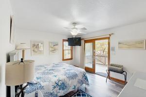 a bedroom with a bed and a ceiling fan at WV09 Play Time in Waves +42 photos