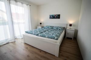 En eller flere senge i et værelse på Ferienwohnung Gaisweiher, Dinkelsbühl