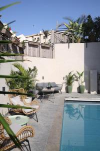 a patio with chairs and a swimming pool at מעגל השמש in Poriyya Illit +32 photos