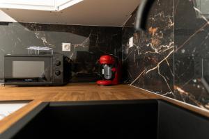 Kuchyň nebo kuchyňský kout v ubytování Yassam- 003- RDC + 13 fotografií