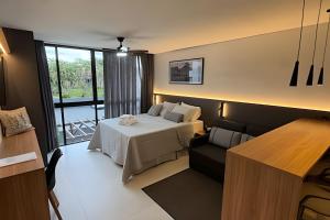 a bedroom with a bed and a chair in a room at Pomer House in Pomerode